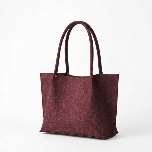 Burgundy patterned tote bag front three-quarter view